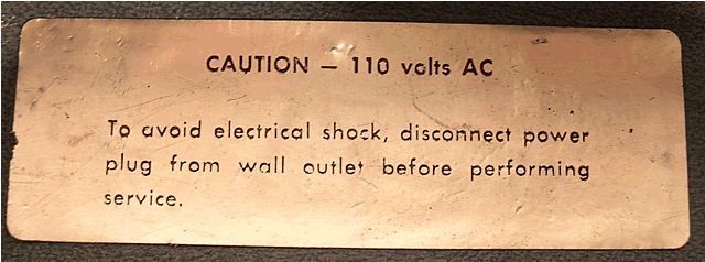Warning inside the power cable storage.