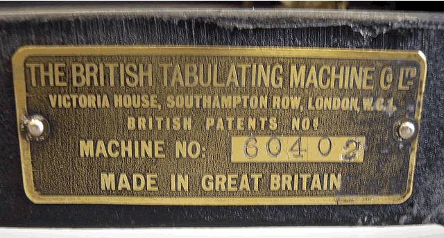  image of Closeup of the manufacturer's tag showing serial number of this British Tabulating Machine Company Type 001 mechanical keypunch (card punch). This manufacturer's nameplate on this rare keypunch helps us date the keypunch and place it in the timeline of computer history. 