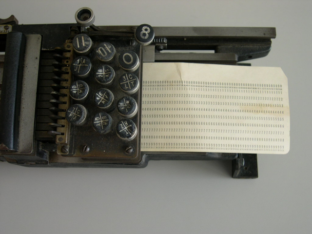 Is this how to load a card into the British Tabulating Machine Company's Type 001 mechanical keypunch (card punch)?  NO, NO, NO!! Cards should be loaded from the left and removed from the right once the holes have been punched.