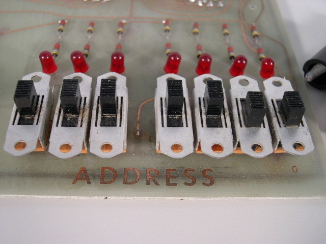Closeup of the 7 ADDRESS switches -- bottom right corner.