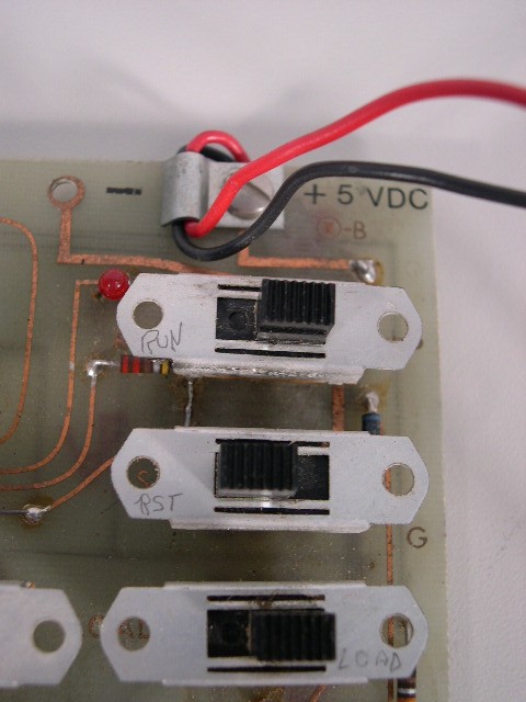 Closeup of RUN, RESET & LOAD switches.